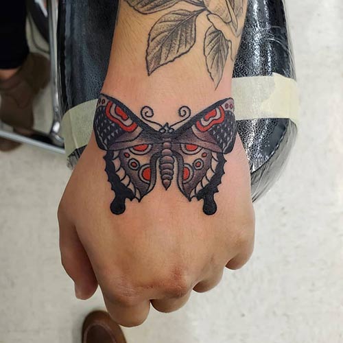 Butterfly hand tattoo design