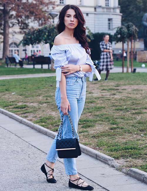 High waisted jeans with an off-shoulder shirt
