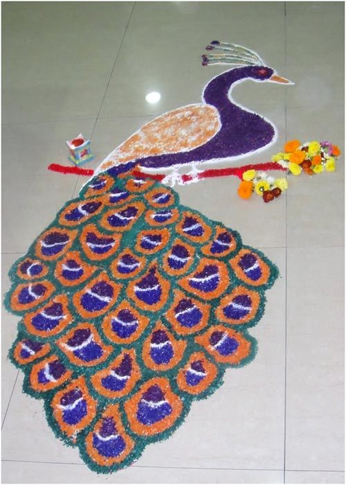 Unique peacock rangoli design for competition with color and flower decoration