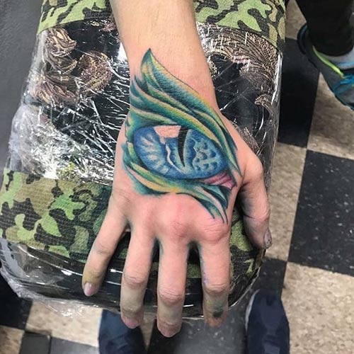 Dragon eye hand tattoo design