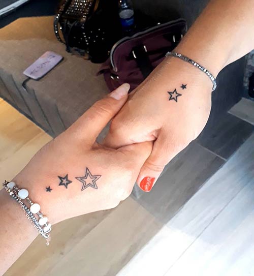 Small stars hand tattoo design