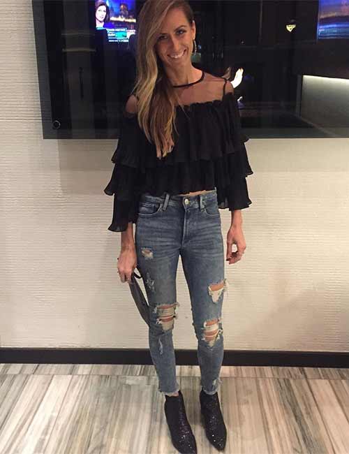 High waisted jeans with a black ruffle top