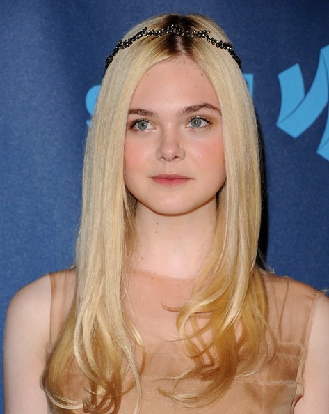 Elle Fanning looked nothing short of ethereal with a sleek and shiny 'do, curled ends, and a delicate hair crown.