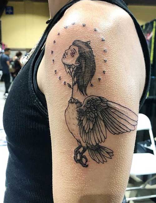 Arm tattoo design of an angel as a bird