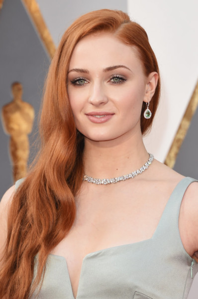 Sophie's gorgeous red hair was styled in loose, casual waves.