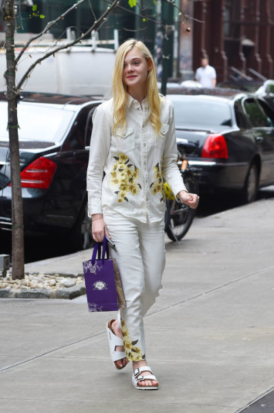 Wearing white denim-on-denim with floral detailing out in New York.