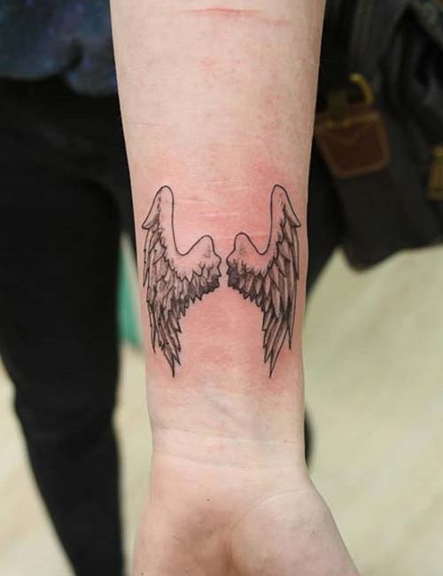 Angel wings tattoo on the wrist