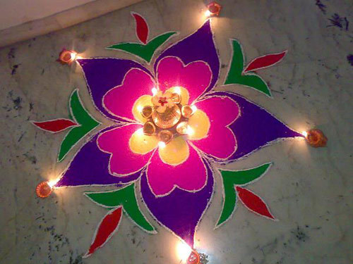 Small pink and violet floral rangoli design
